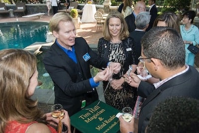 tim-hall-corporate-magician-performing-up-close-and-personal-for-adults-poolside-party