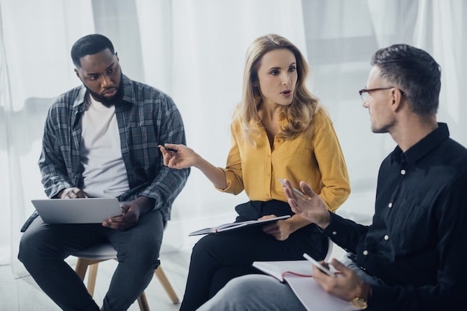 team-building-activity-the-magic-of-collaboration-two-men-woman-talking-listening