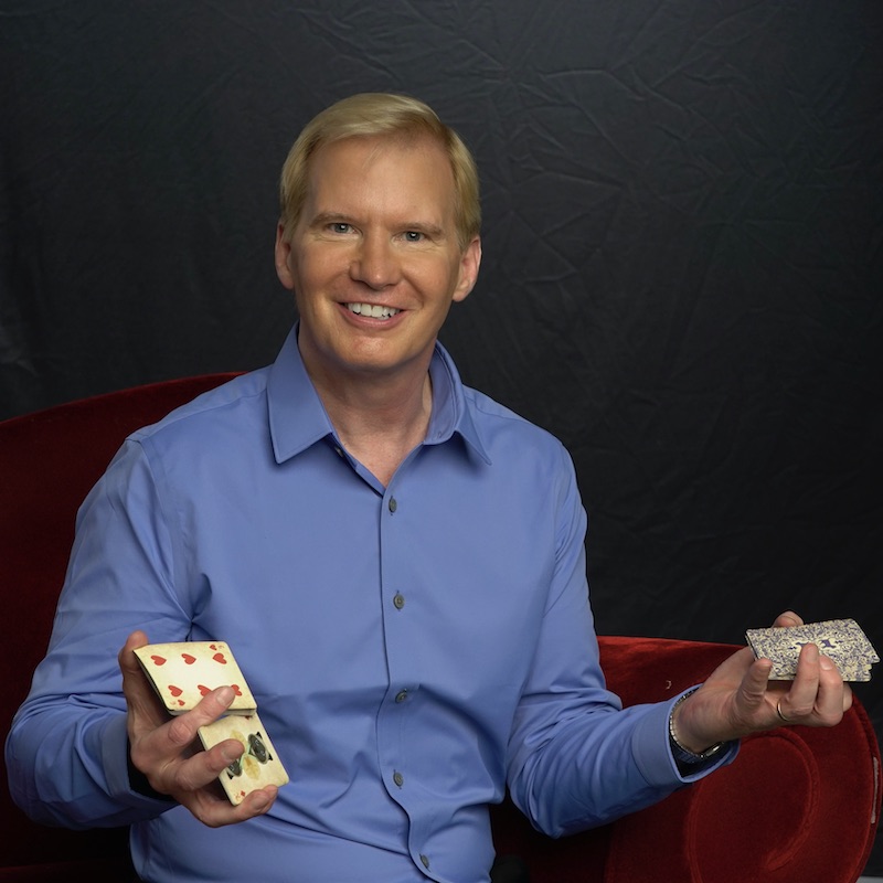 tim-hall-comedy-magician-mind-reader-deck-of-playing-cards-in-his-hands